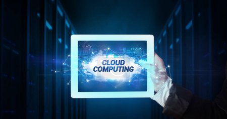 Photo for Young business person working on tablet and shows the inscription: CLOUD COMPUTING - Royalty Free Image