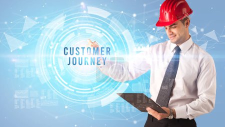 Photo for Handsome businessman with helmet drawing CUSTOMER JOURNEY inscription, contruction business concept - Royalty Free Image