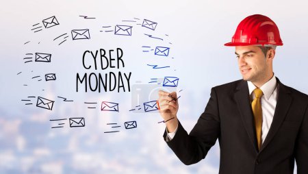 Photo for Handsome businessman with helmet drawing CYBER MONDAY inscription, contruction sale concept - Royalty Free Image
