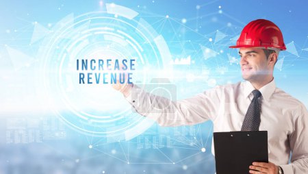 Photo for Handsome businessman with helmet drawing INCREASE REVENUE inscription, contruction business concept - Royalty Free Image