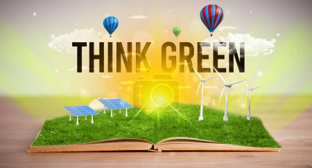 Foto de Libro abierto con inscripción THINK GREEN, concepto de energía renovable - Imagen libre de derechos