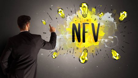Foto de Hombre de negocios dibujo bombilla de colores con abreviatura NFV, concepto de idea de nueva tecnología - Imagen libre de derechos