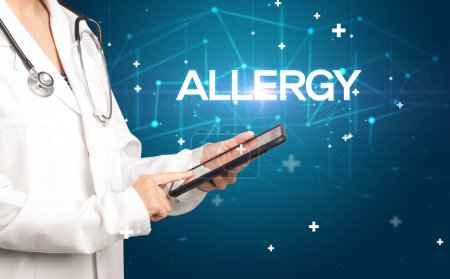 Photo for Doctor fills out medical record with ALLERGY inscription, medical concept - Royalty Free Image