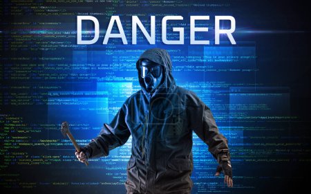 Photo for Faceless hacker with DANGER inscription on a binary code background - Royalty Free Image