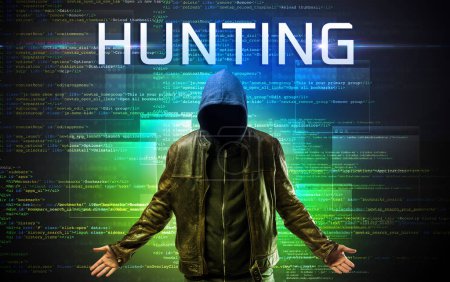 Photo for Faceless hacker with HUNTING inscription on a binary code background - Royalty Free Image