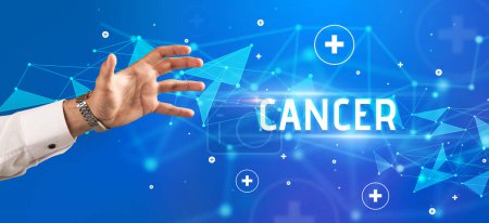 Photo for Close-Up of cropped hand pointing at CANCER inscription, medical concept - Royalty Free Image