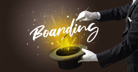 Photo for Magician is showing magic trick with Boarding inscription, traveling concept - Royalty Free Image