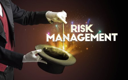 Photo for Illusionist is showing magic trick with RISK MANAGEMENT inscription, new business model concept - Royalty Free Image
