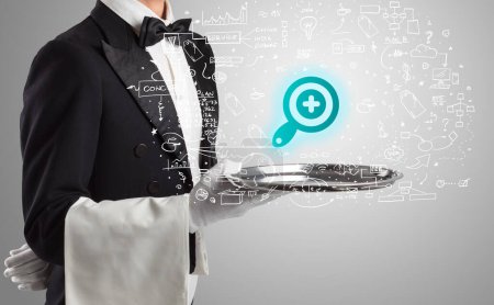 Photo for Close-up of waiter serving magnifying glass icons, social media concept - Royalty Free Image