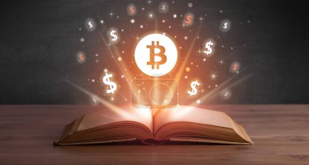 Foto de Libro abierto con iconos de bitcoin arriba, concepto de cambio de divisas - Imagen libre de derechos