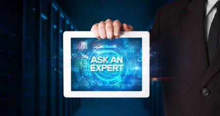 Photo for Young business person working on tablet and shows the inscription: ASK AN EXPERT, business concept - Royalty Free Image