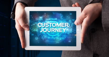 Photo for Young business person working on tablet and shows the inscription: CUSTOMER JOURNEY, business concept - Royalty Free Image
