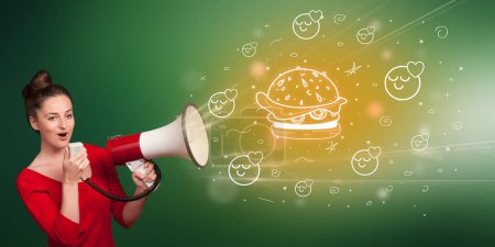 Téléchargez les photos : Jeune personne criant en mégaphone et juteuse icône hamburger, concept de saine alimentation - en image libre de droit