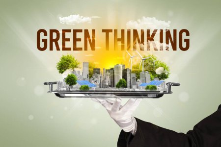 Photo for Waiter serving eco city with GREEN THINKING inscription, renewabke energy concept - Royalty Free Image