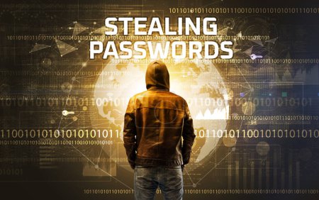Téléchargez les photos : Hacker sans visage au travail avec inscription STEALING PASSWORDS, concept de sécurité informatique - en image libre de droit