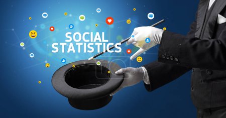 Photo for Magician is showing magic trick with SOCIAL STATISTICS inscription, social media marketing concept - Royalty Free Image