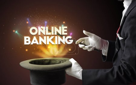 Photo for Illusionist is showing magic trick with ONLINE BANKING inscription, new business model concept - Royalty Free Image