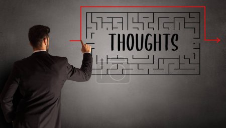 Photo for Businessman drawing maze with THOUGHTS inscription, business education concept - Royalty Free Image