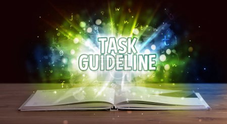 Photo for TASK GUIDELINE inscription coming out from an open book, educational concept - Royalty Free Image