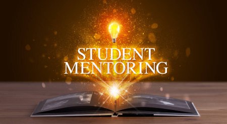 Photo for STUDENT MENTORING inscription coming out from an open book, educational concept - Royalty Free Image