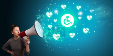 Photo for Young person shouting in megaphone and handicapped icon, medical concept - Royalty Free Image