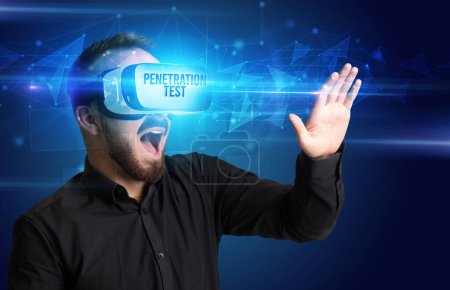 Photo for Businessman looking through Virtual Reality glasses with PENETRATION TEST inscription, cyber security concept - Royalty Free Image