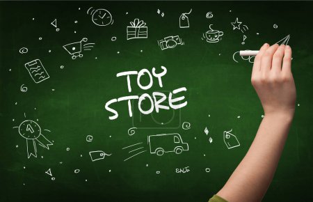 Photo for Hand drawing TOY STORE inscription with white chalk on blackboard, online shopping concept - Royalty Free Image