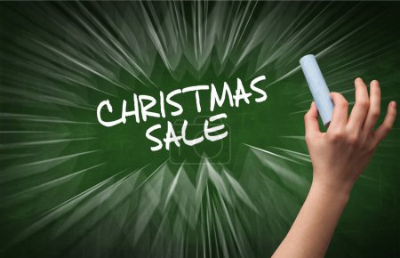 Photo for Hand drawing CHRISTMAS SALE inscription with white chalk on blackboard, online shopping concept - Royalty Free Image