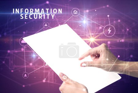 Photo for Holding futuristic tablet with INFORMATION SECURITY inscription, cyber security concept - Royalty Free Image
