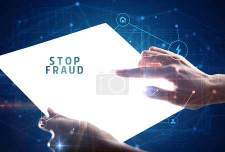 Photo for Holding futuristic tablet with STOP FRAUD inscription, cyber security concept - Royalty Free Image