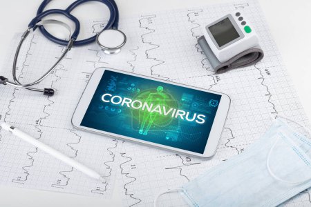 Photo for Tablet pc and doctor tools with CORONAVIRUS inscription, coronavirus concept - Royalty Free Image