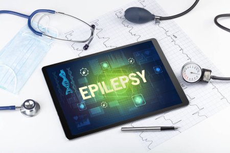 Foto de Tablet PC y material médico con inscripción EPILEPSY, concepto de prevención - Imagen libre de derechos