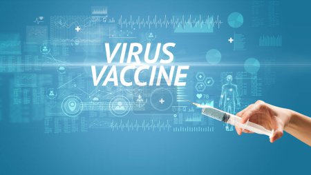 Foto de Aguja jeringa con vacuna contra virus e inscripción VIRUS VACCINE, concepto antídoto - Imagen libre de derechos