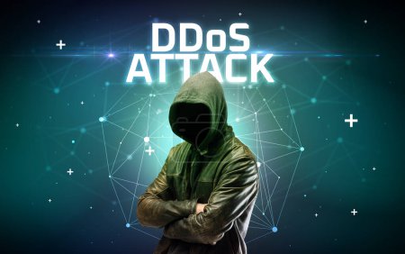 Photo for Mysterious hacker with DDoS ATTACK inscription, online attack concept inscription, online security concept - Royalty Free Image