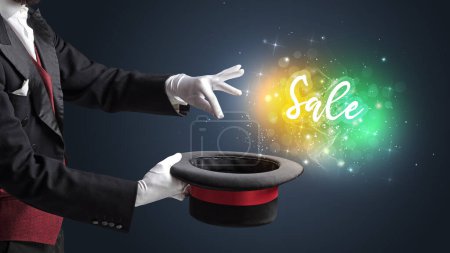 Photo for Magician hand conjure with wand and Sale inscription, shopping concept - Royalty Free Image