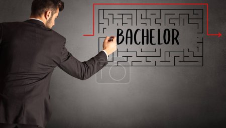 Photo for Businessman drawing maze with BACHELOR inscription, business education concept - Royalty Free Image
