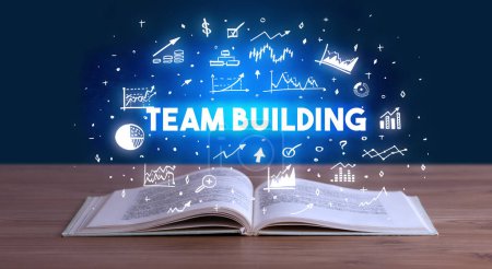 Photo for TEAM BUILDING inscription coming out from an open book, business concept - Royalty Free Image
