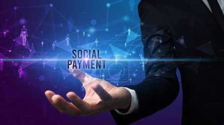 Photo for Elegant hand holding SOCIAL PAYMENT inscription, social networking concept - Royalty Free Image