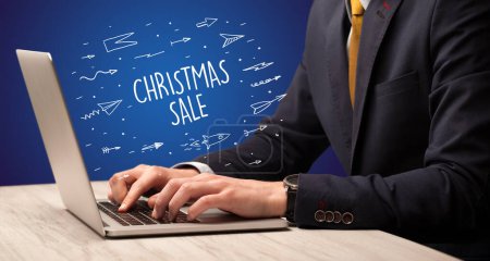 Photo for Businessman working on laptop with CHRISTMAS SALE inscription, online shopping concept - Royalty Free Image