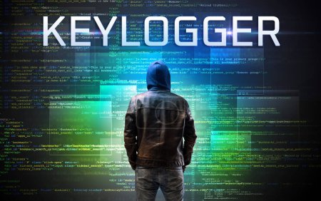 Foto de Pirata informático sin rostro con inscripción KEYLOGGER en un fondo de código binario - Imagen libre de derechos