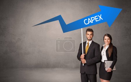 Photo for Young business person in casual holding road sign with CAPEX inscription, business direction concept - Royalty Free Image