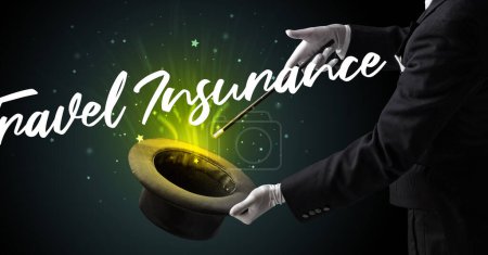 Photo for Magician is showing magic trick with Travel Insurance inscription, traveling concept - Royalty Free Image