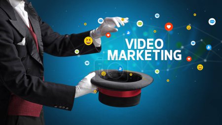 Photo for Magician is showing magic trick with VIDEO MARKETING inscription, social media marketing concept - Royalty Free Image