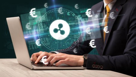 Photo for Business hand working in stock market with ripple icons coming out from laptop screen - Royalty Free Image