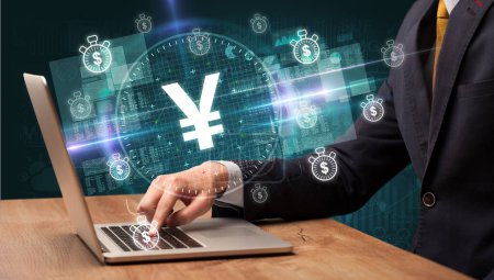 Photo for Business hand working in stock market with yen icons coming out from laptop screen - Royalty Free Image