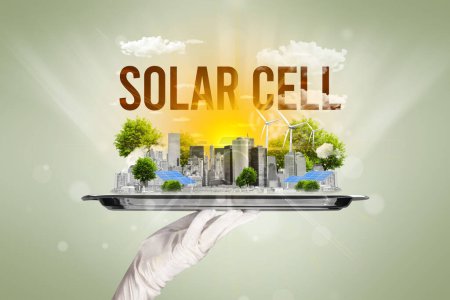 Foto de Camarero sirviendo eco ciudad con inscripción SOLAR CELL, concepto de energía renovable - Imagen libre de derechos