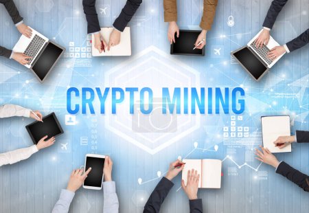 Photo for Group of Busy People Working in an Office with CRYPTO MINING inscription, modern technology concept - Royalty Free Image