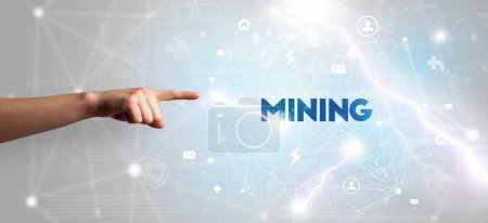Photo for Hand pointing at MINING inscription, modern technology concept - Royalty Free Image