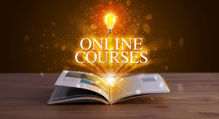 Photo for ONLINE COURSES inscription coming out from an open book, educational concept - Royalty Free Image