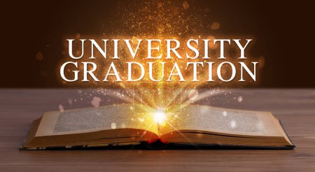 Photo for UNIVERSITY GRADUATION inscription coming out from an open book, educational concept - Royalty Free Image